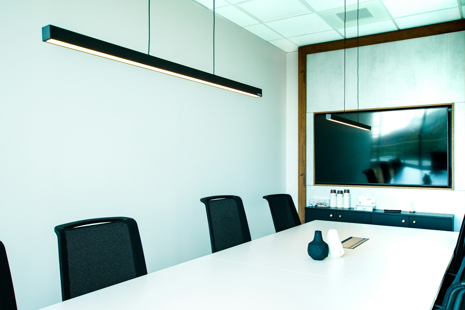 Minimal meeting room with linear lighting