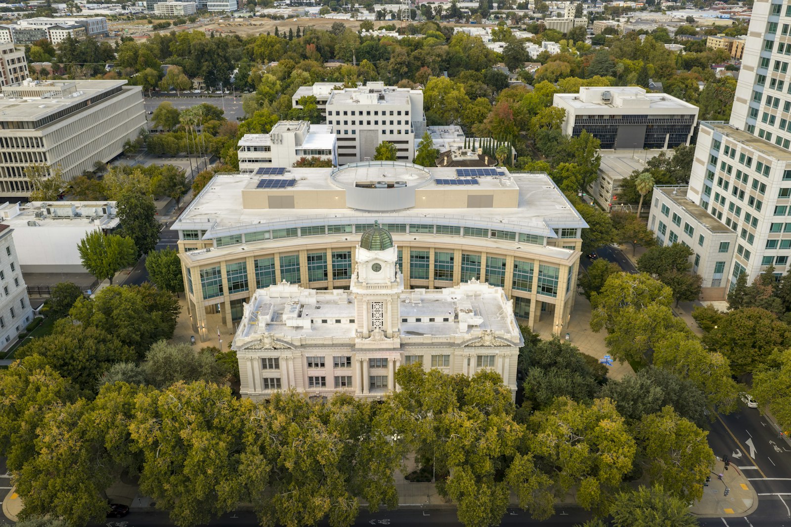 Civic building among trees from above