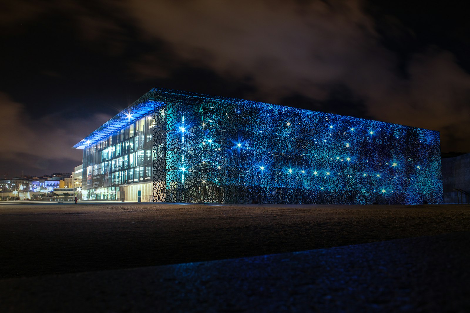 Data center building lit at night